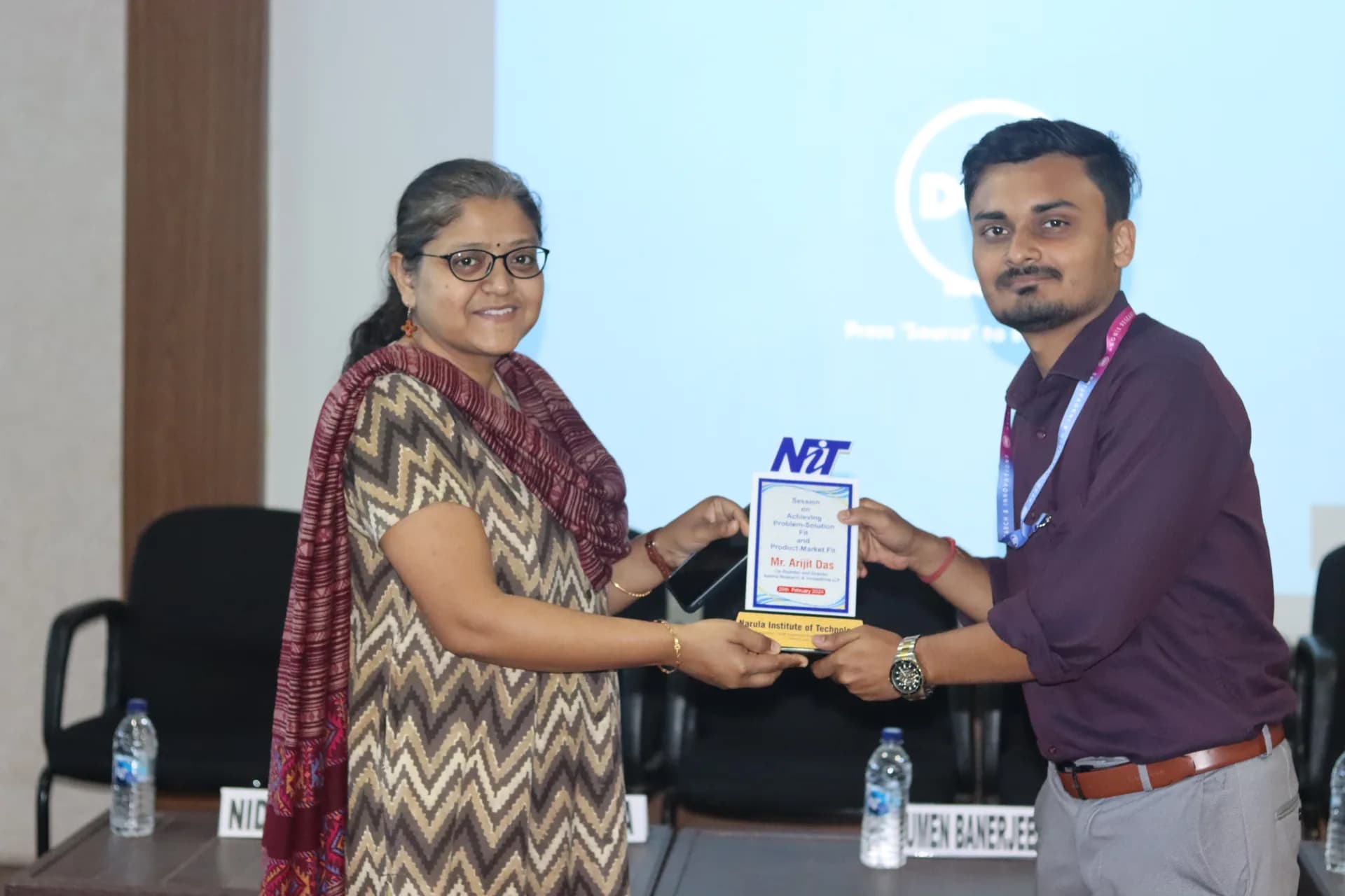 Aeonix receiving a memento at a technical session